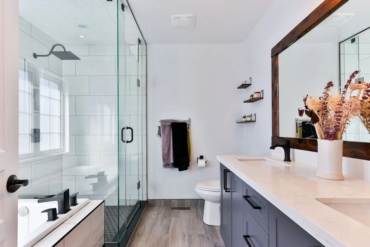 Freestanding bath with warm lighting and fitted vanity storage