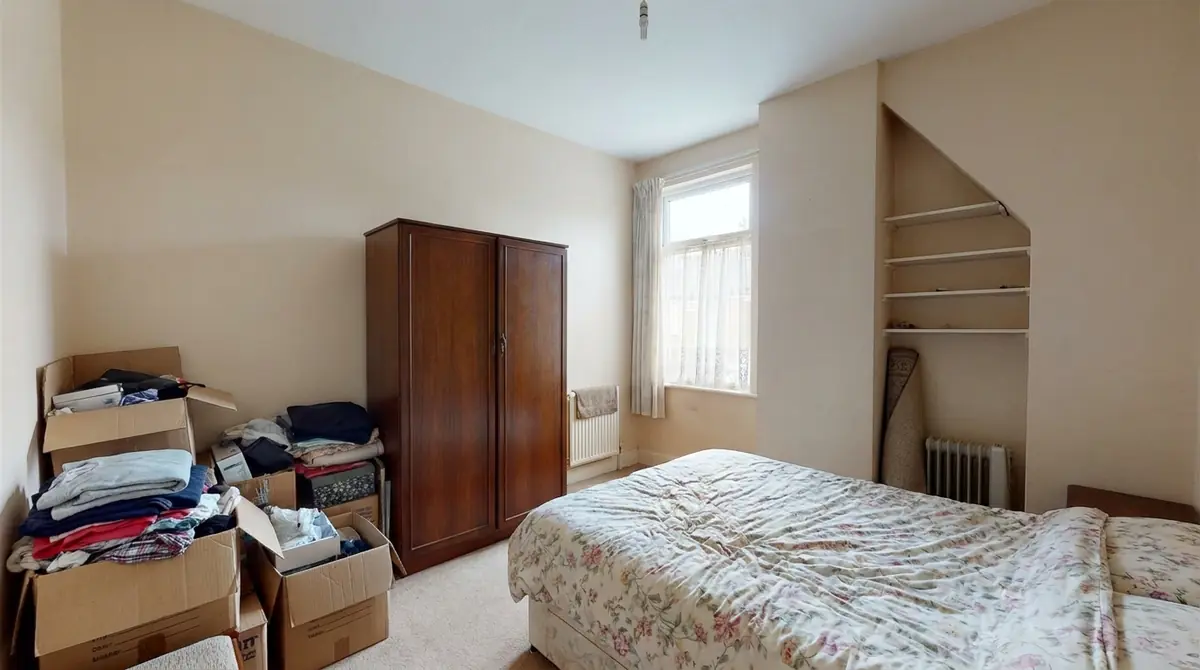 Bedroom after fitted wardrobes with calm concealed storage