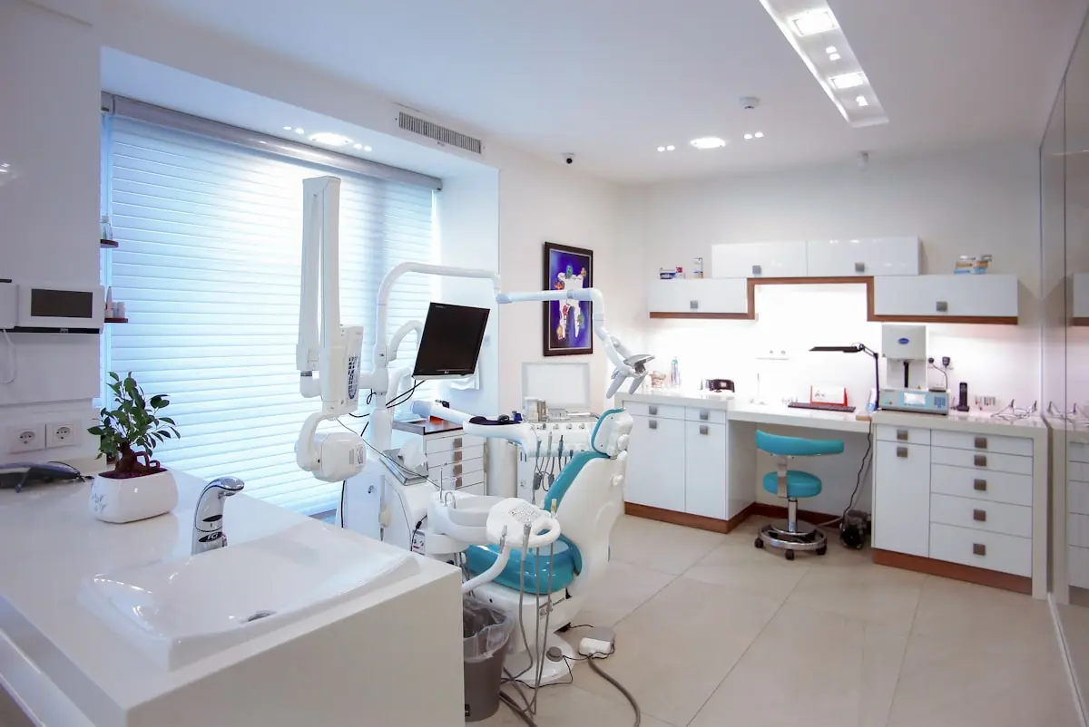 Patient smiling confidently after a dental treatment at Oakridge Clinic