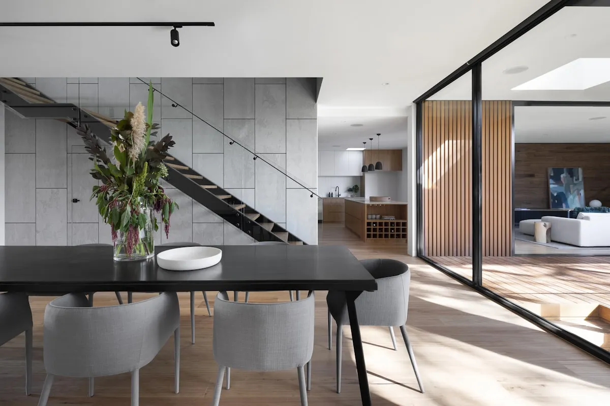 Contemporary living area with stone, timber and a low furniture line