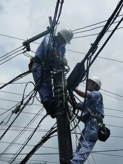 Electrician working on an electrical service line