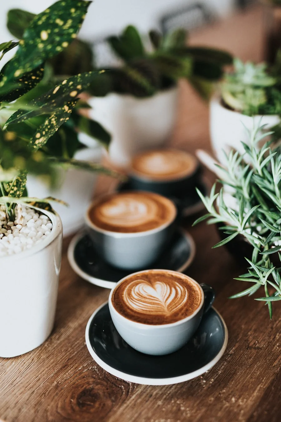 Batch brew coffee beside ceramic cups