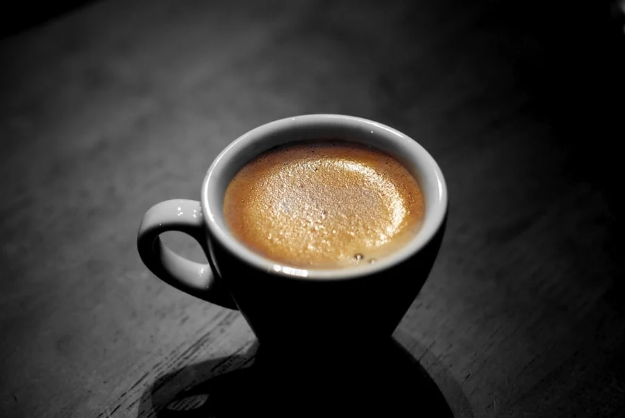 Espresso pouring into a small cup