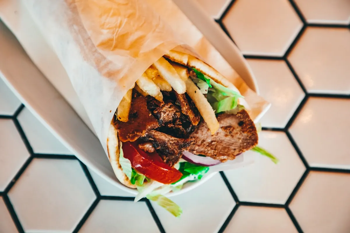 Charcoal mixed grill platter with grilled meat and salad